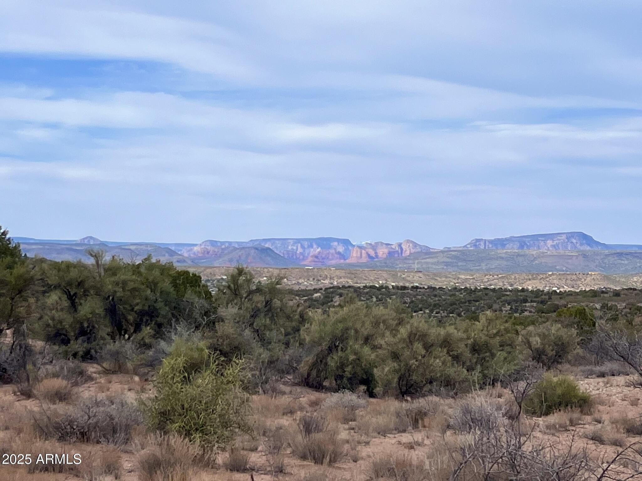 3075 Sonora Pass, Unit 65 Rimrock, AZ 86335 - Photo 7 of 17 a view of a town with mountains in the background