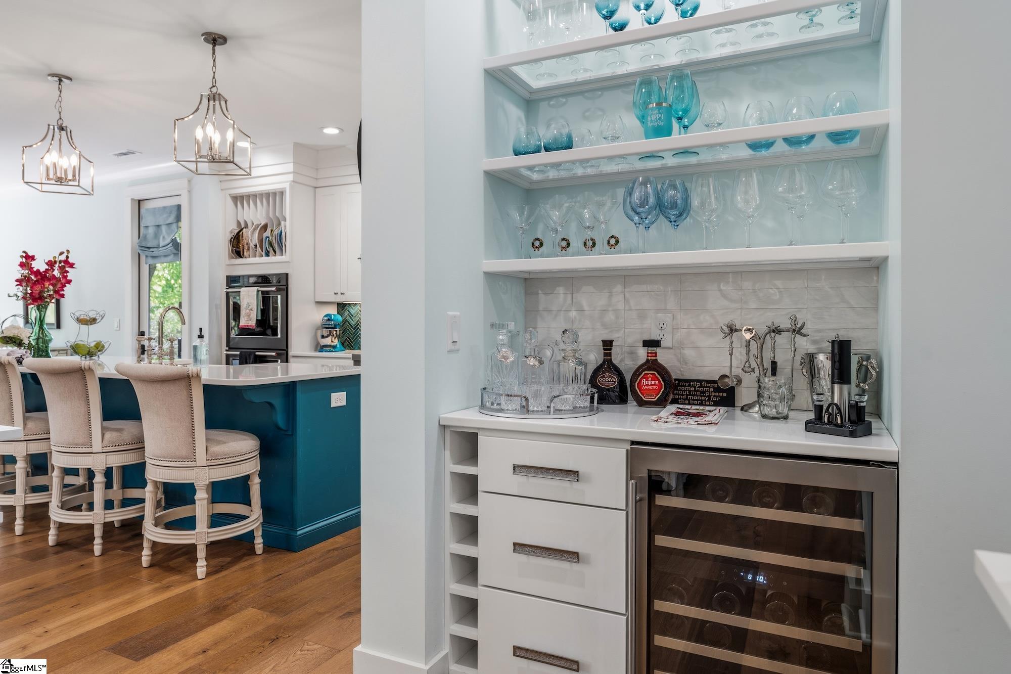 158 Tully Drive Anderson, SC 29621 - Photo 12 of 49 Wine fridge, glass shelving, drawers and pearlescent tile backsplash