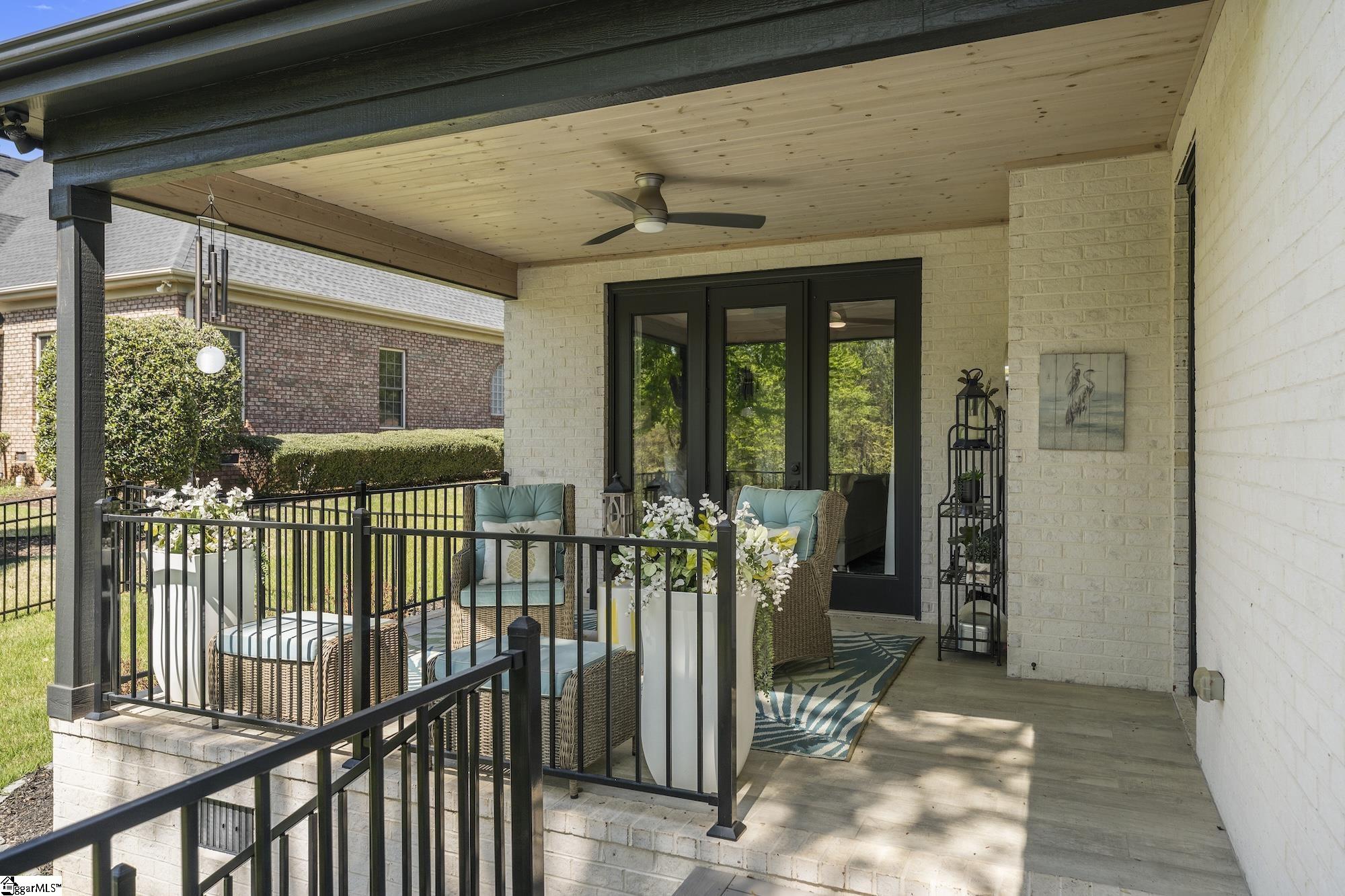 158 Tully Drive Anderson, SC 29621 - Photo 37 of 49 Private covered porch off the primary bedroom with tongue and groove ceiling, fan, and tile flooring.