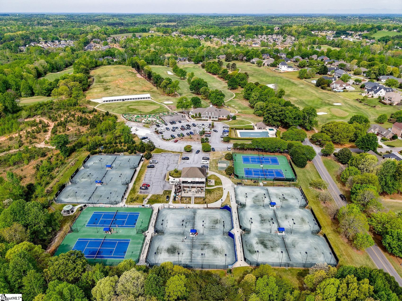 158 Tully Drive Anderson, SC 29621 - Photo 46 of 49 Aerial views of tennis/pickleball courts, pool, clubhouse, mini-golf and driving range.