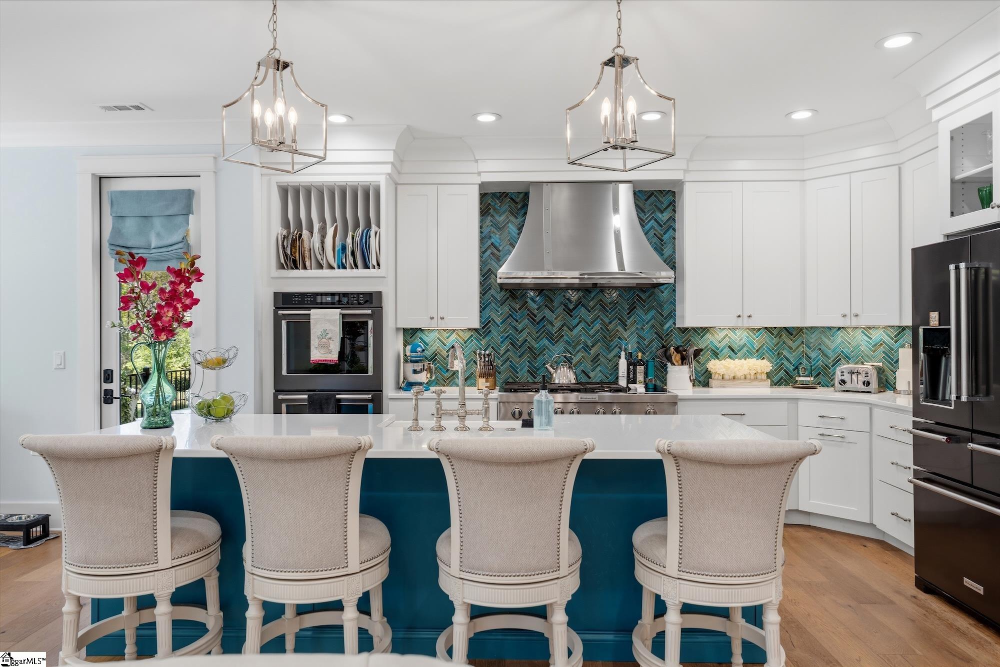 158 Tully Drive Anderson, SC 29621 - Photo 7 of 49 Features quartz island with farmhouse apron sink, exquisite glass tile backsplash, Kitchen Aide 6 burner gas range with stainless hood, double ovens.
