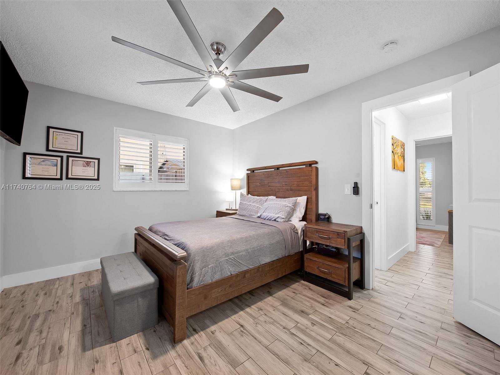 413 Southeast 4th Terrace Dania Beach, FL 33004 - Photo 13 of 25 a bedroom with bed and wooden floor