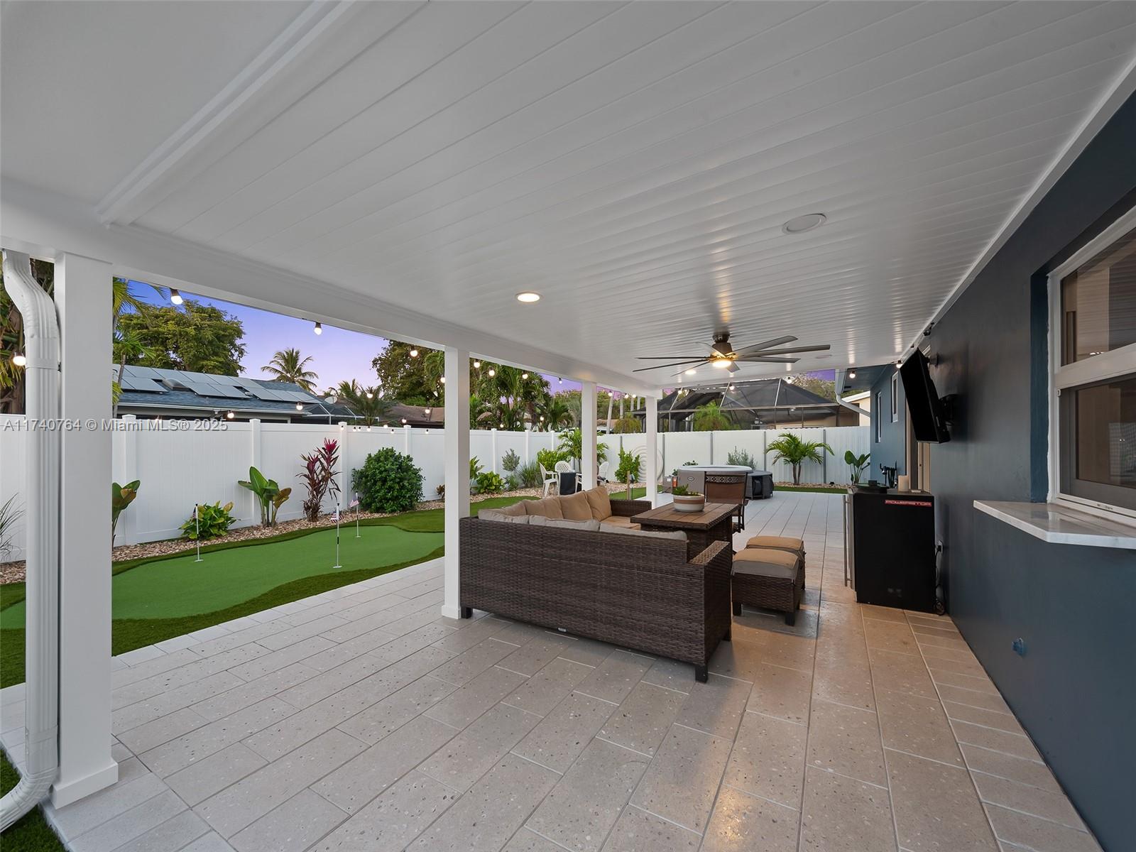 413 Southeast 4th Terrace Dania Beach, FL 33004 - Photo 21 of 25 a living room with furniture and a garden