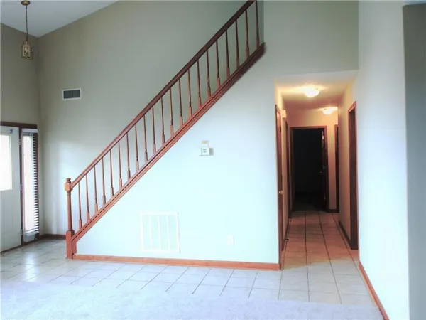a view of a hallway with staircase
