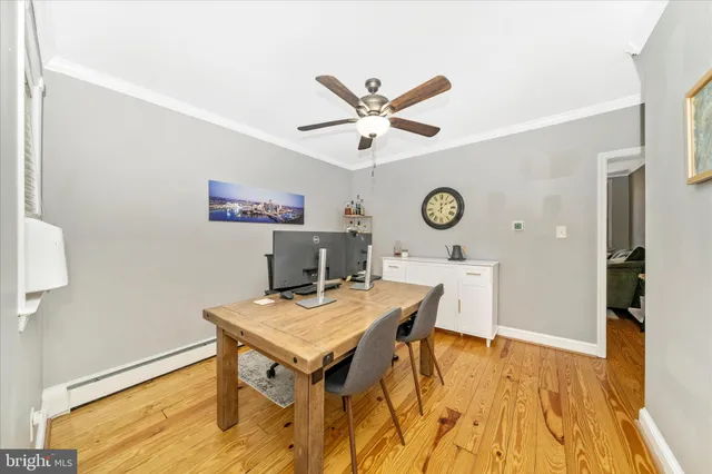 a kitchen with a sink stainless steel appliances a counter top space cabinets and a window
