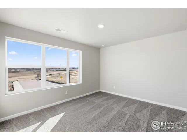 a bathroom with a sink double vanity granite tub and a mirror