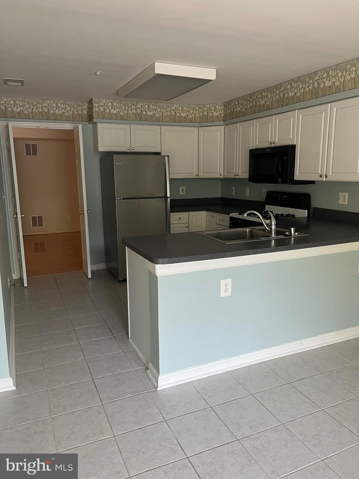 12320 Rosslare Ridge Road, Unit 202 Lutherville-Timonium, MD 21093 - Photo 18 of 35 View of kitchen from dining room