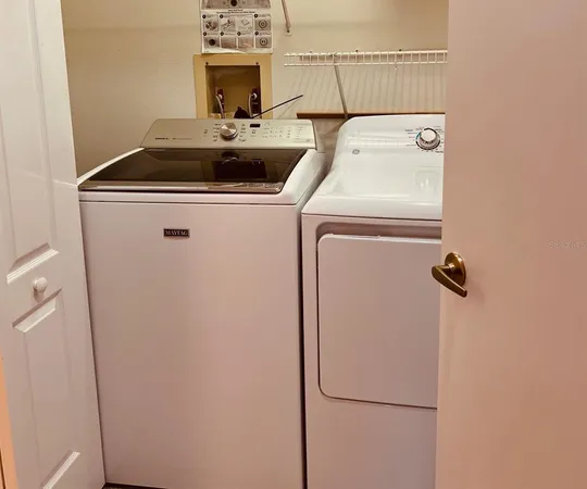 a utility room with dryer and washer