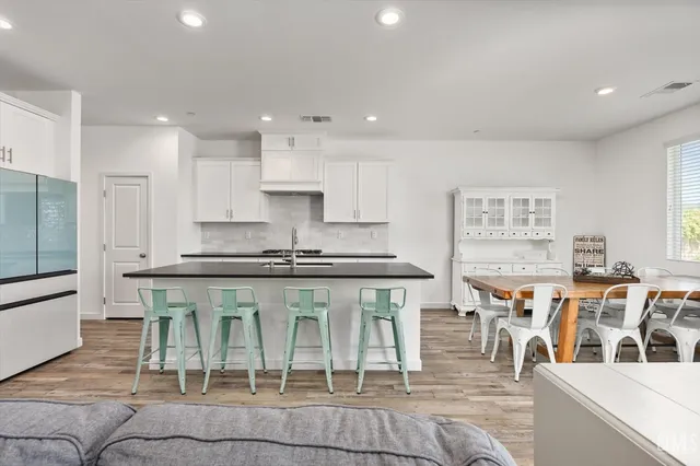 a kitchen with a table and chairs in it
