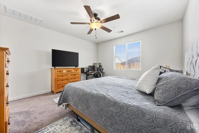 a spacious bathroom with a shower a sink and a mirror
