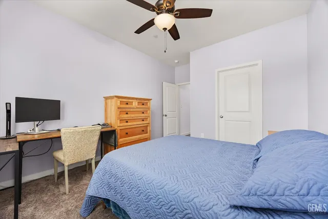a bathroom with a toilet sink and shower