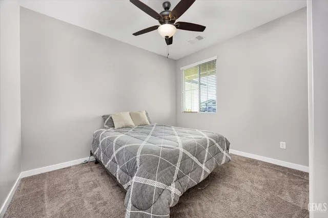 a spacious bathroom with double sink a mirror a vanity and a shower