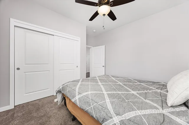 a bathroom with a toilet and a shower curtain