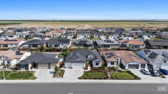 an aerial view of a house with swimming pool