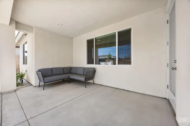 a view of a house with swimming pool and sitting area