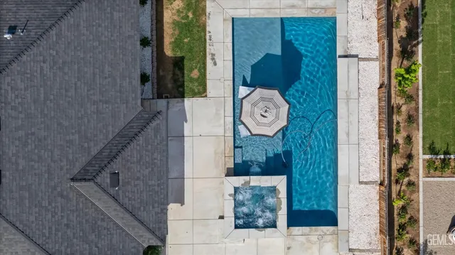 an aerial view of a house with a garden