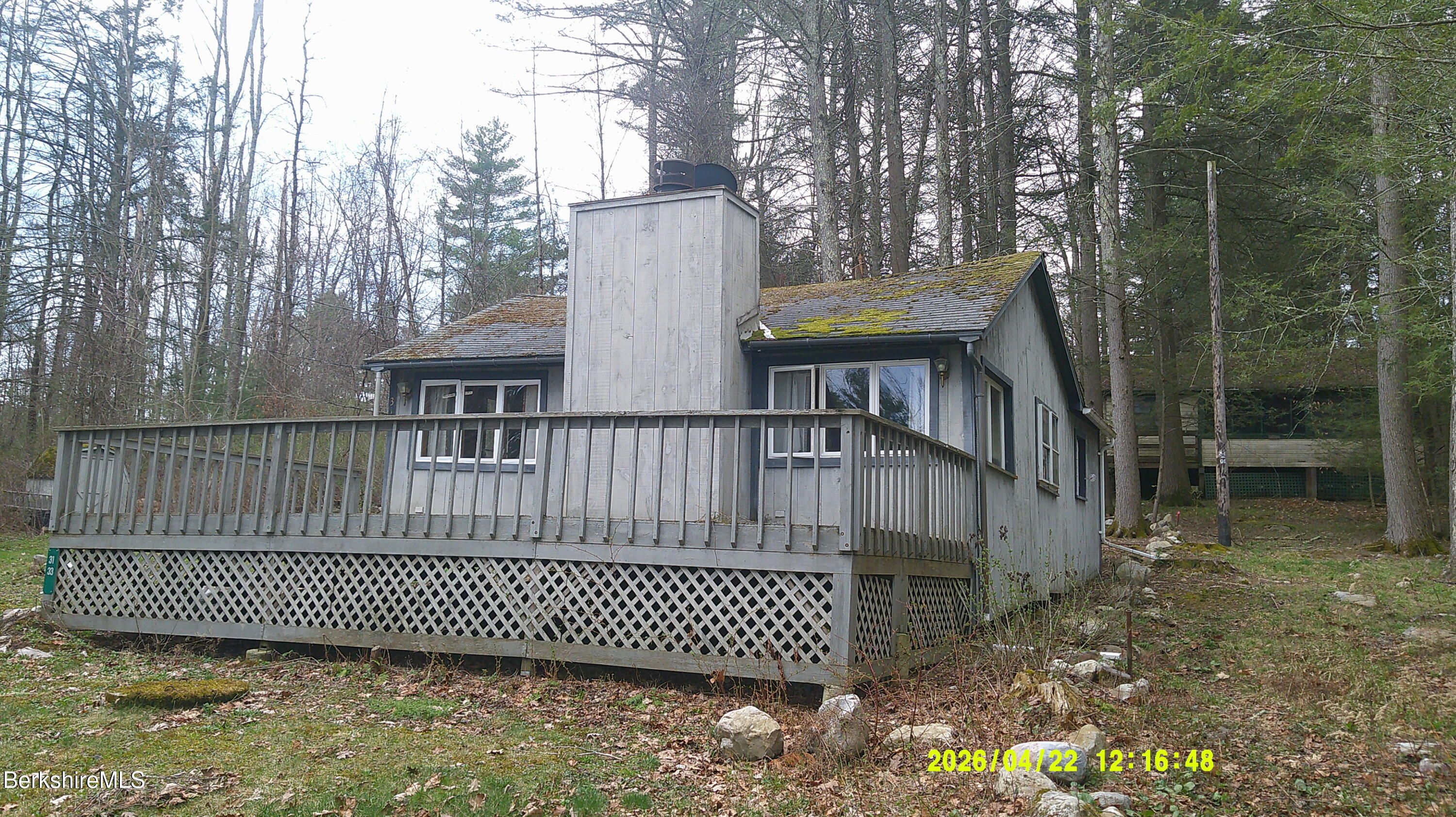 33 Pine Road New Marlborough, MA 01230 - Photo 3 of 11 a view of a brick house with a bench