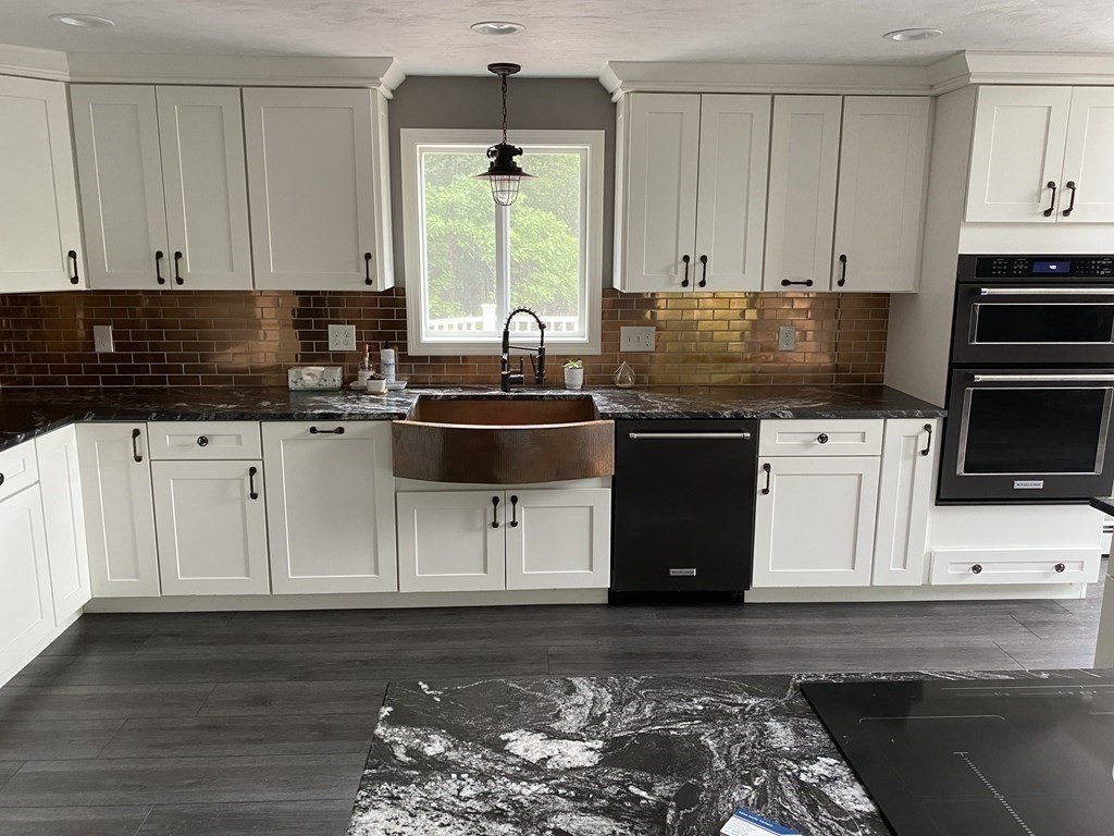 80 Fitzpatrick Road Grafton, MA 01519 - Photo 4 of 29 a kitchen with stainless steel appliances kitchen island granite countertop a stove a sink and a microwave