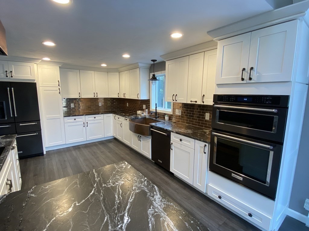 80 Fitzpatrick Road Grafton, MA 01519 - Photo 5 of 29 a kitchen with granite countertop a stove a sink and a refrigerator