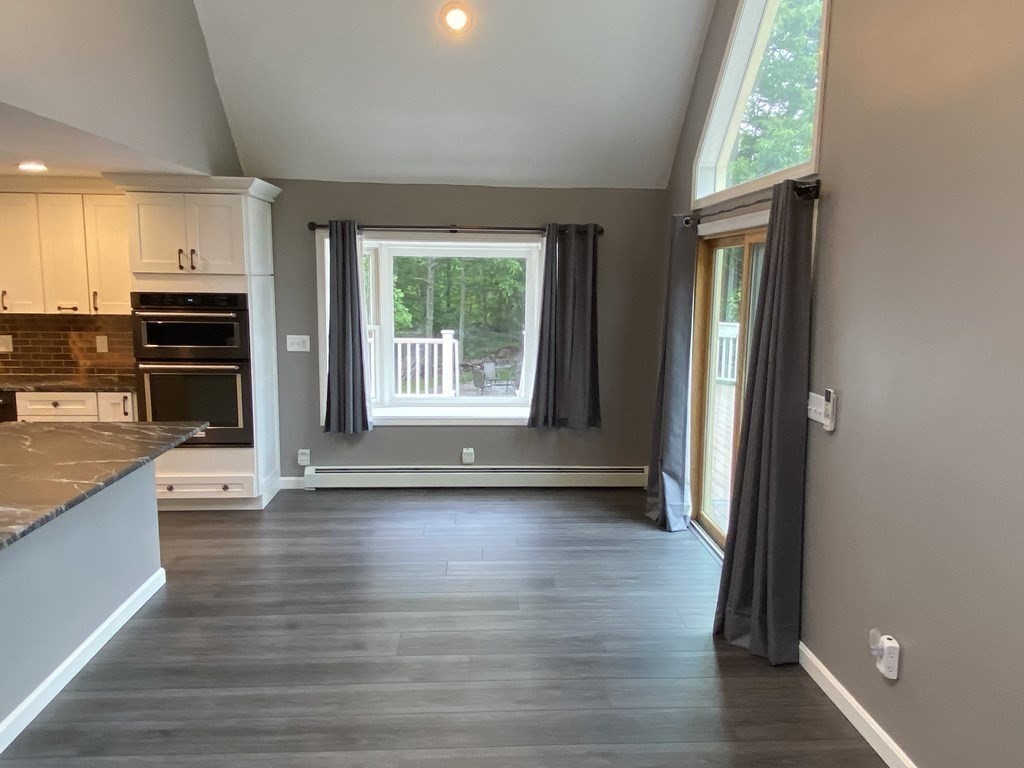 80 Fitzpatrick Road Grafton, MA 01519 - Photo 9 of 29 an empty room with wooden floor and windows