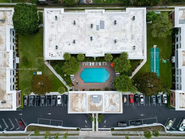 an aerial view of multiple houses with outdoor space