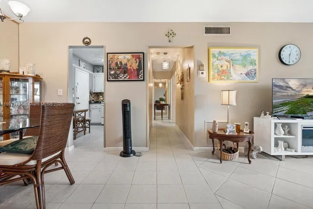a view of a livingroom with furniture and a flat screen tv