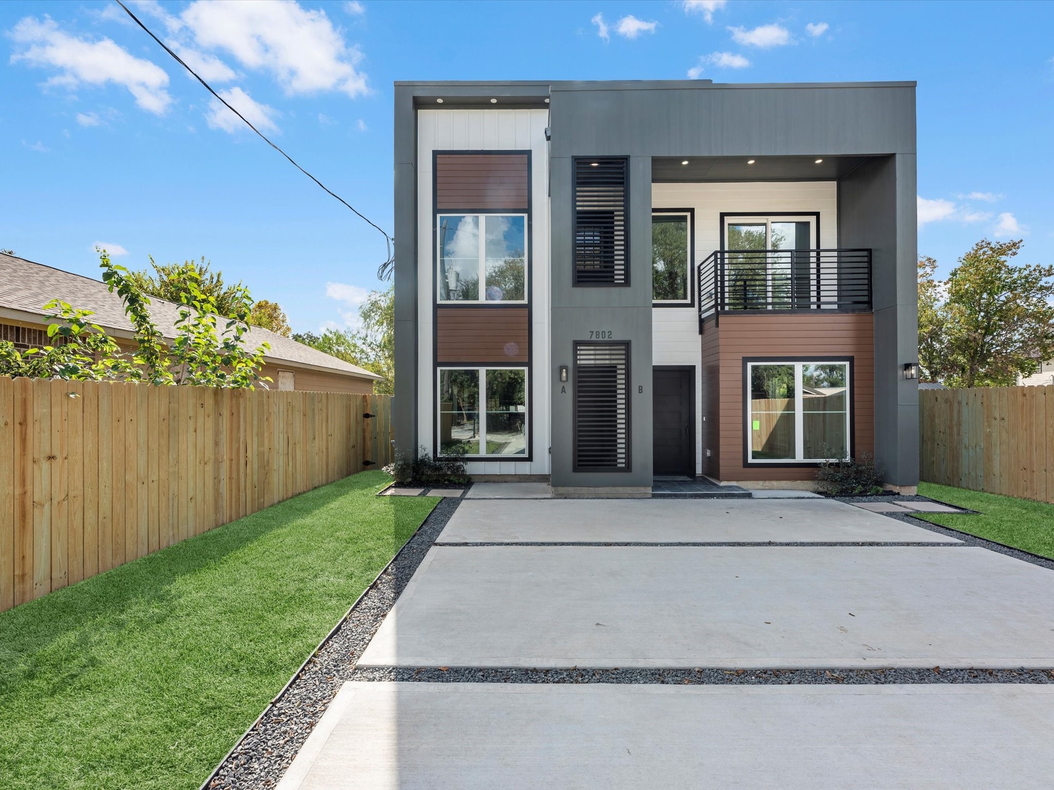 7802 Queen Street, Unit A Houston, TX 77028 - Photo 2 of 40 front view of a brick house with a yard