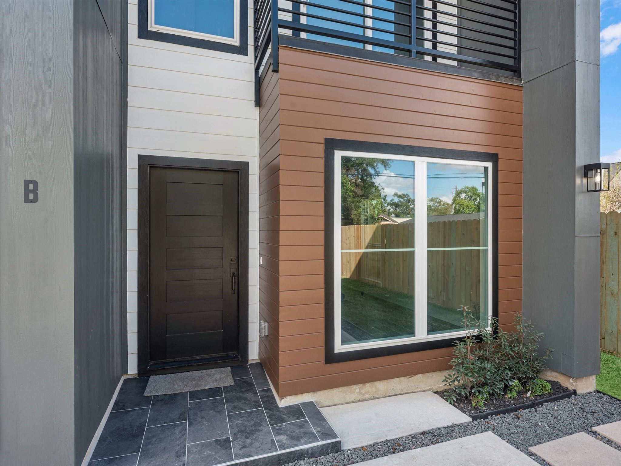 7802 Queen Street, Unit A Houston, TX 77028 - Photo 23 of 40 a front view of a house with a garden