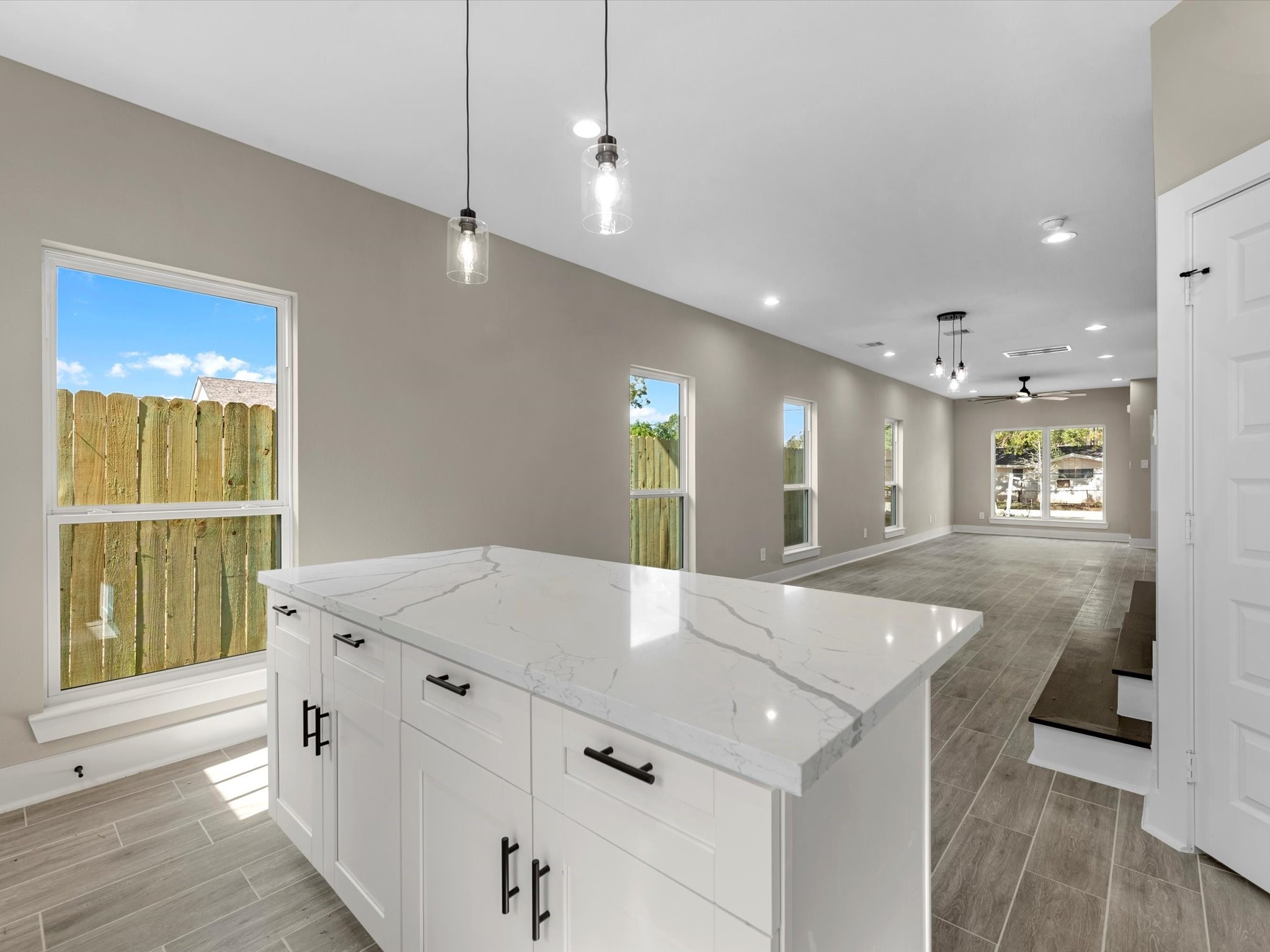 7802 Queen Street, Unit A Houston, TX 77028 - Photo 30 of 40 a open kitchen with kitchen island a sink a center island and stainless steel appliances