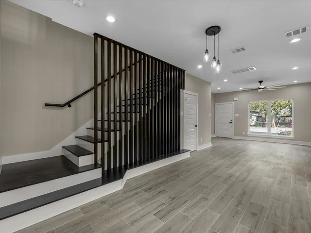 a view of a kitchen with a sink stove and cabinets