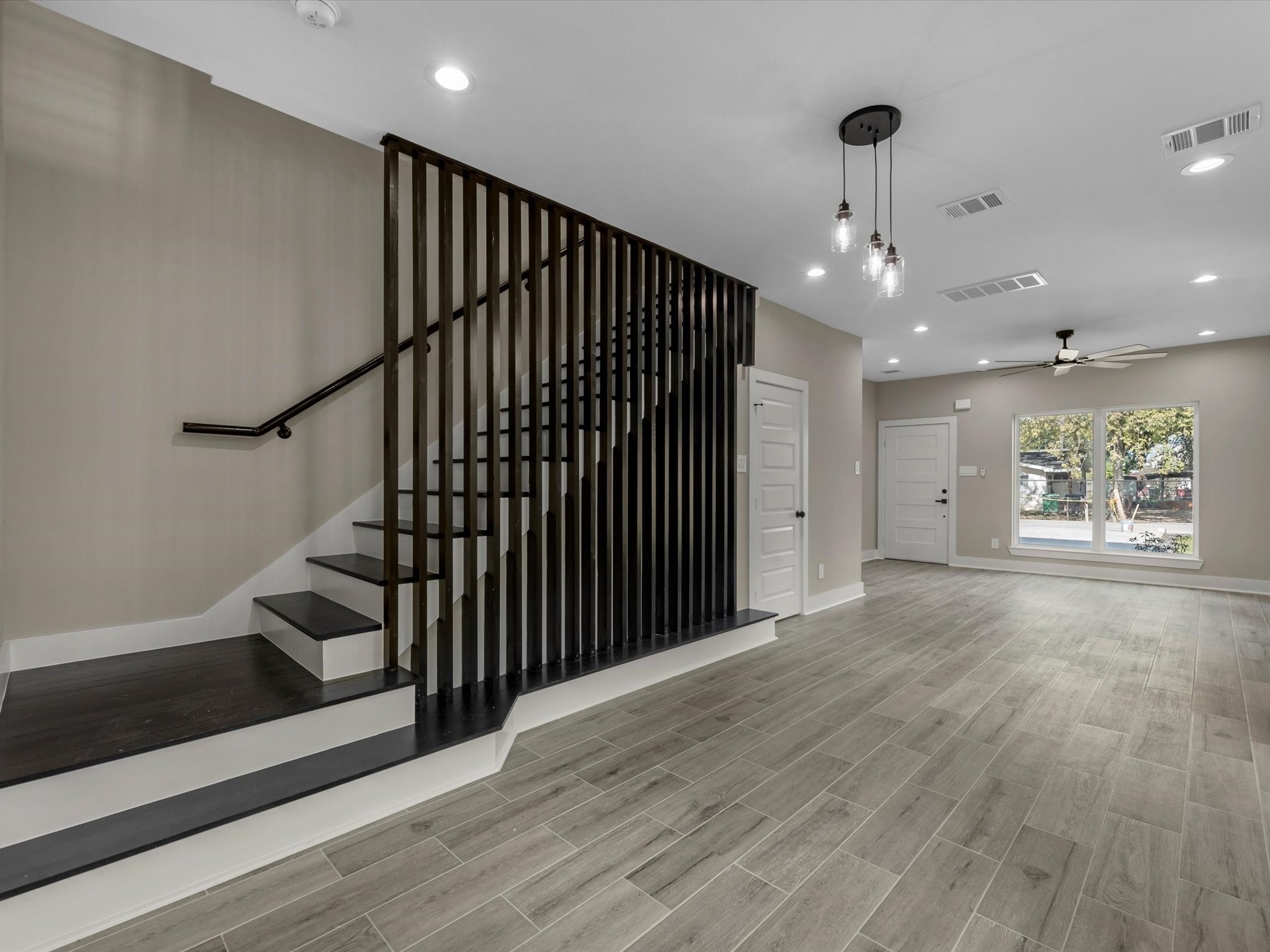 7802 Queen Street, Unit A Houston, TX 77028 - Photo 8 of 40 a view of an empty room with wooden floor
