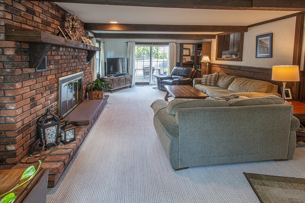 54 South Shore Drive Springfield, MA 01118 - Photo 15 of 39 a living room with furniture and a fireplace