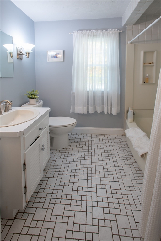 54 South Shore Drive Springfield, MA 01118 - Photo 22 of 39 a bathroom with a sink a toilet and a mirror