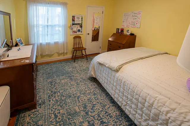 a bed room with a bed and a window