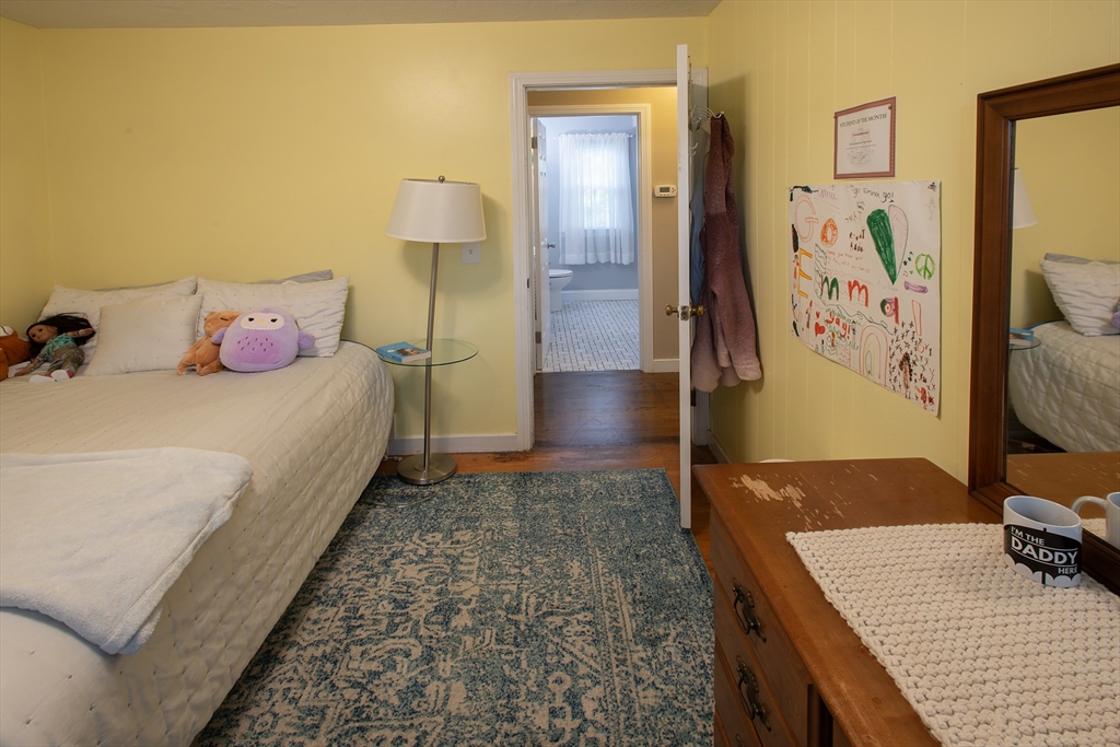 54 South Shore Drive Springfield, MA 01118 - Photo 24 of 39 a bedroom with a bed and a flat screen tv