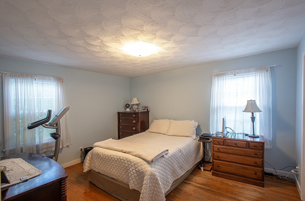 54 South Shore Drive Springfield, MA 01118 - Photo 25 of 39 a bedroom with a bed and a table
