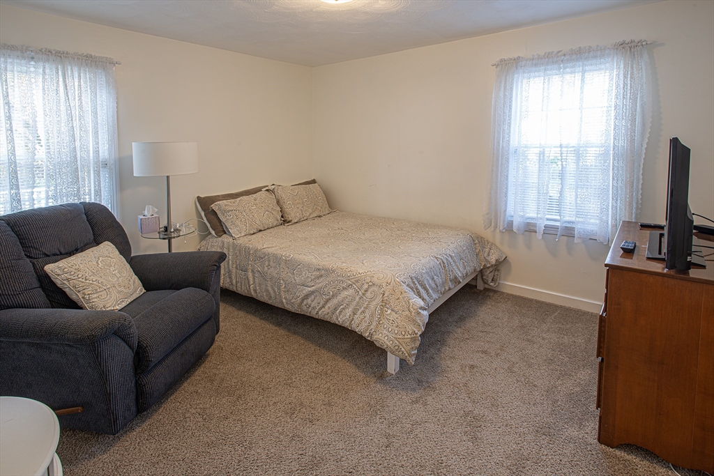 54 South Shore Drive Springfield, MA 01118 - Photo 26 of 39 a bed room with a bed and a television