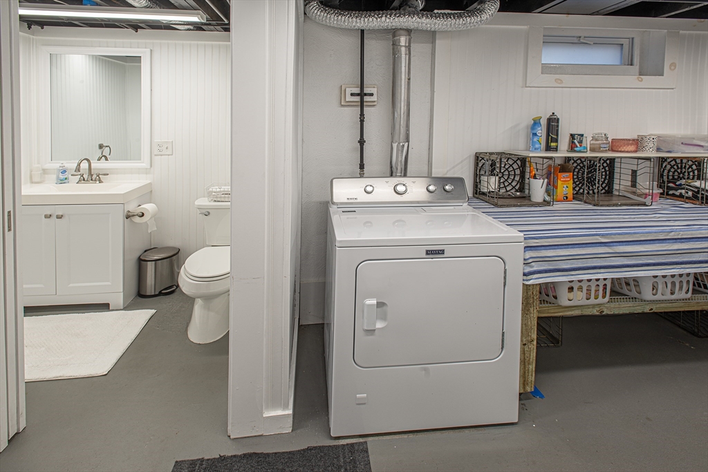 54 South Shore Drive Springfield, MA 01118 - Photo 28 of 39 a bathroom with a sink toilet and a vanity