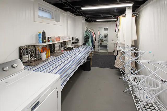 a utility room with multiple dryer and washer