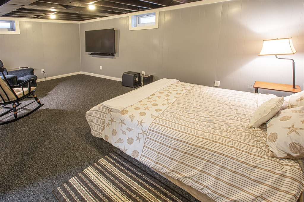 54 South Shore Drive Springfield, MA 01118 - Photo 32 of 39 a bedroom with a bed and a flat screen tv