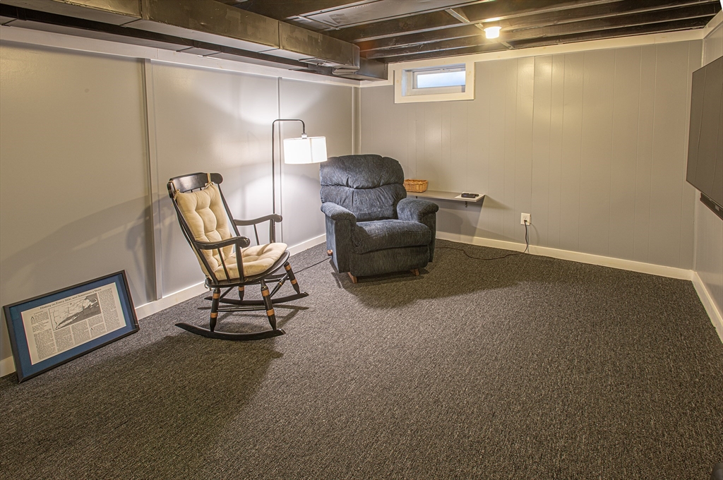 54 South Shore Drive Springfield, MA 01118 - Photo 33 of 39 a living room with furniture and a lamp