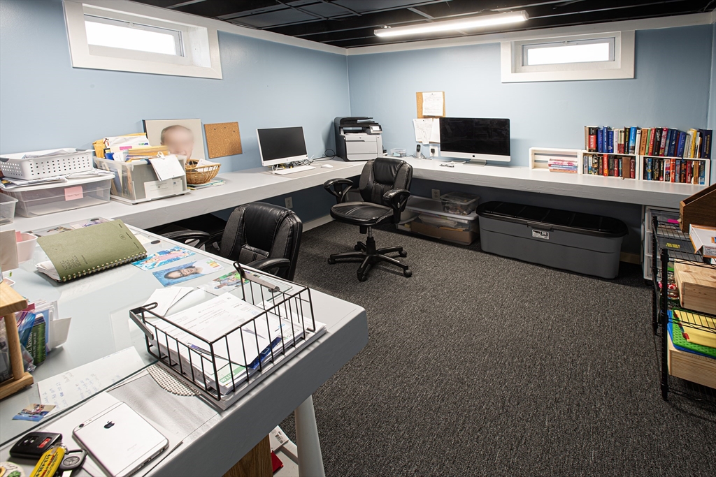 54 South Shore Drive Springfield, MA 01118 - Photo 34 of 39 a work room with furniture a flat screen tv and a window