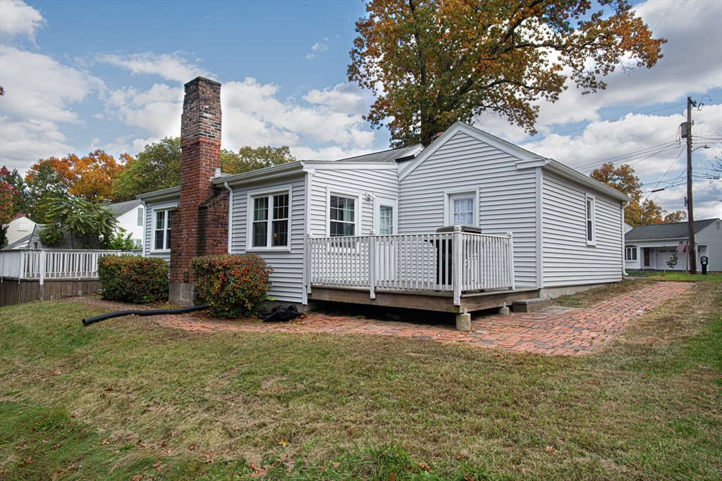 54 South Shore Drive Springfield, MA 01118 - Photo 4 of 39 a view of a house with backyard and a tree