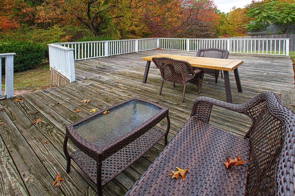 54 South Shore Drive Springfield, MA 01118 - Photo 8 of 39 a view of a roof deck with a table and chairs