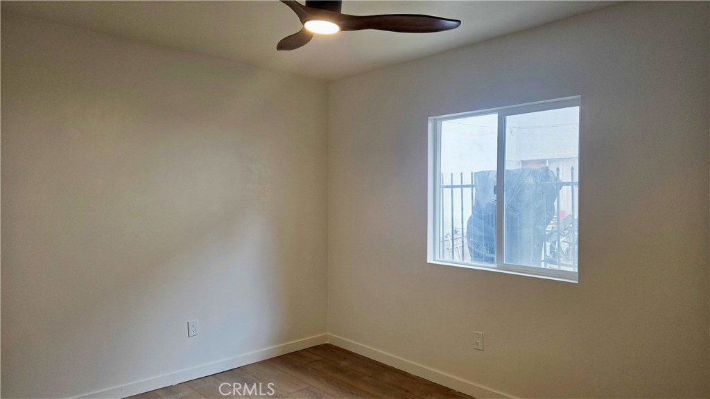 11171 Bullis Road Lynwood, CA 90262 - Photo 4 of 15 an empty room with a window