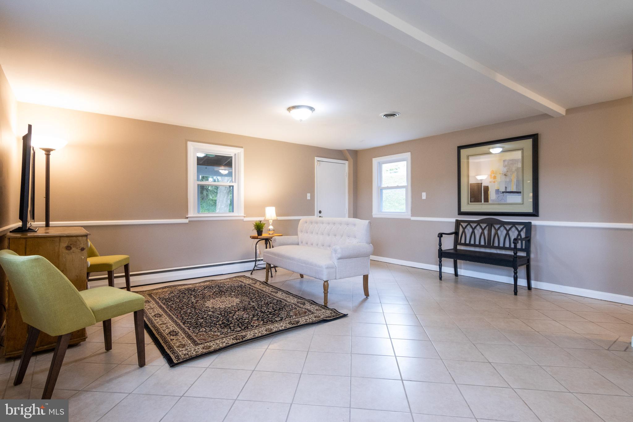 601 Squires Road Towson, MD 21286 - Photo 22 of 47 Family Room with ceramic flooring.
