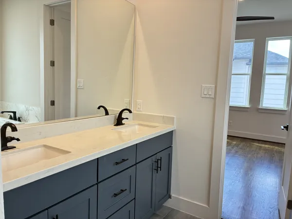a white toilet sitting next to a bathroom sink