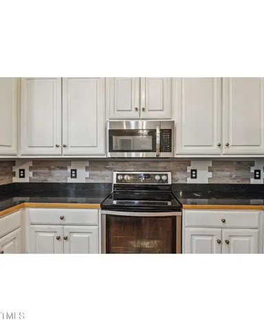 a picture of a living room with a sink