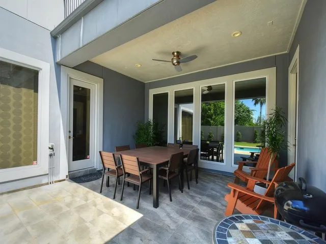 a view of a dining room with furniture wooden floor and a rug