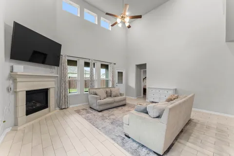 a living room with furniture and a fireplace